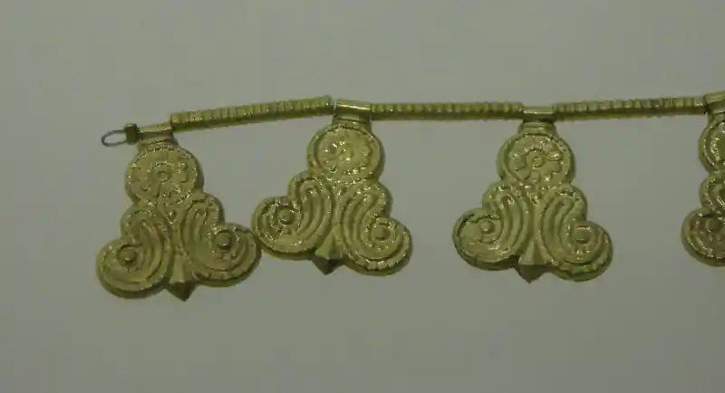 Solar symbol on a pendant on a bracelet